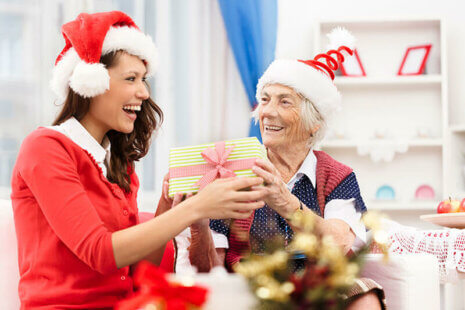 happy caregiver and senior lady during the holidays