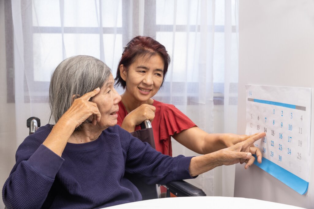 A heartfelt moment between a caregiver and a senior engaged in nurturing dementia care activities, symbolizing enhanced care and emotional connection.