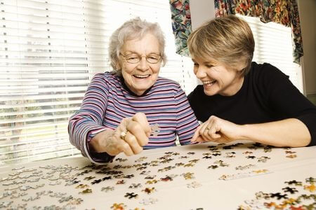 Caregiver providing dementia care for a senior
