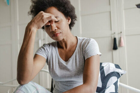 distressed female caregiver struggling with fatigue