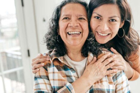 Hispanic older woman with daughter in memory care