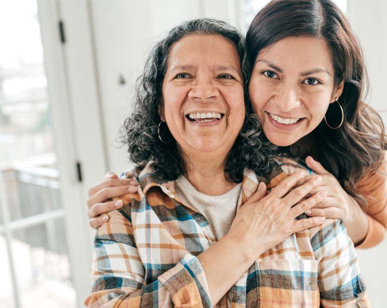 Hispanic older woman with daughter in memory care