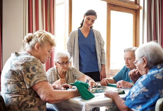 A group of women at an adult day care for seniors.
