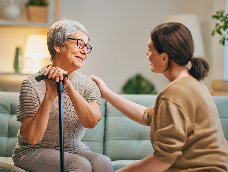 Elderly woman and caregiver using Effective Communication with Dementia Patients