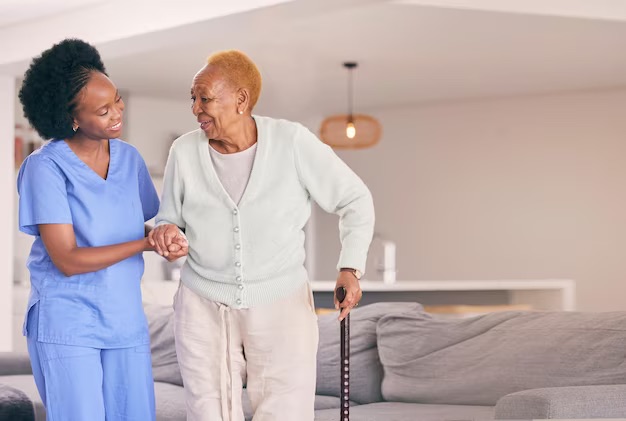 Elderly woman and caregiver Creating a Dementia-Friendly Environment
