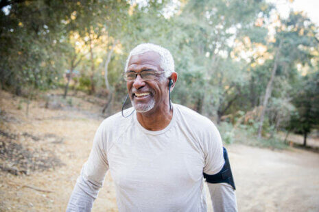 A senior black man running outside to prevent vitamin D deficiency in seniors.