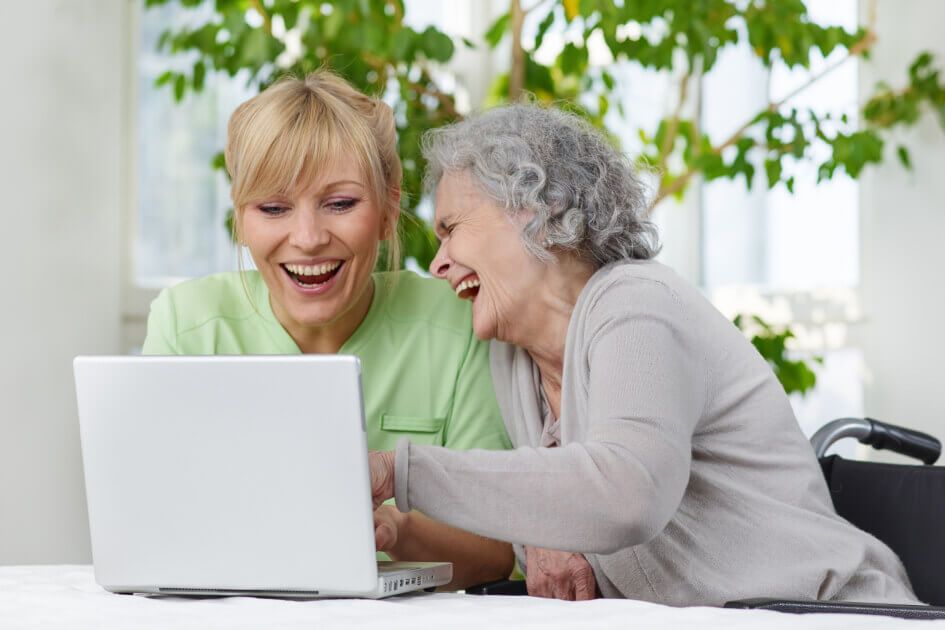 An elderly mother and her daughter discussing the transition from assisted living.