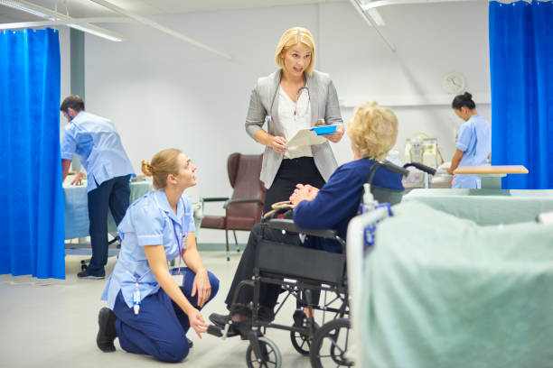 a senior patient is helped by a young nurse after hospital discharge