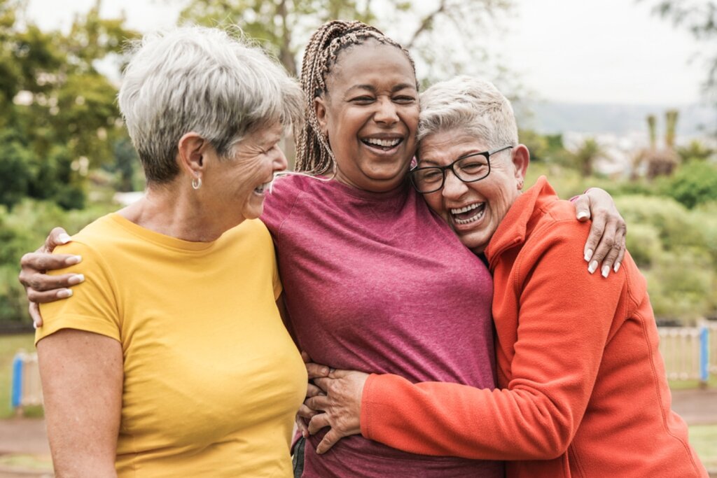 Happy multiracial senior women having fun together outdoor