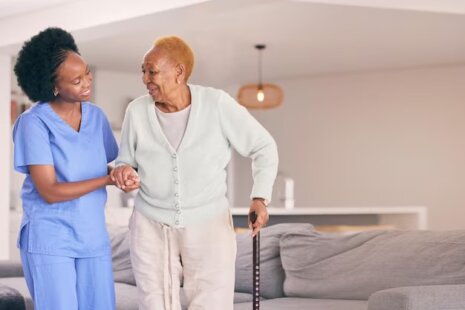 Elderly woman and caregiver Creating a Dementia-Friendly Environment