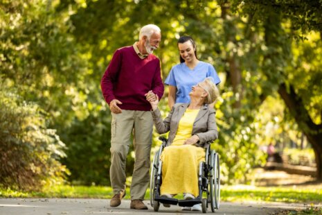 Elderly couple with caregiver for respite care for seniors.