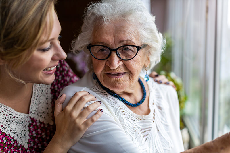 caregiver redirecting senior with Alzheimer's