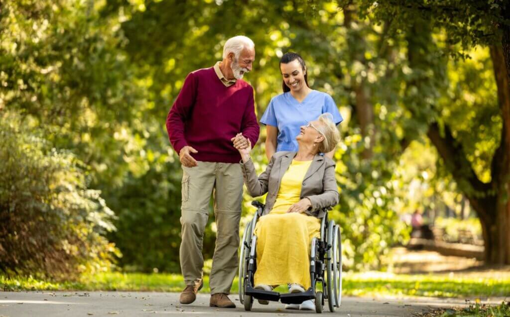 Elderly couple with caregiver for respite care for seniors.