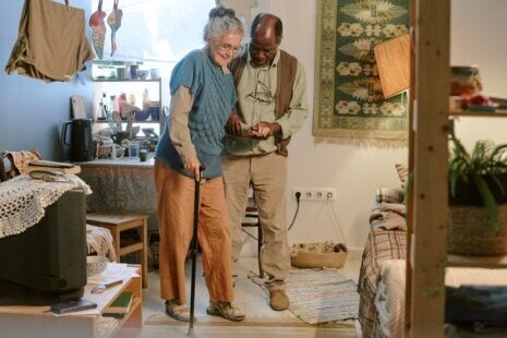 Family caregiver supporting stroke survivor during stroke recovery at home